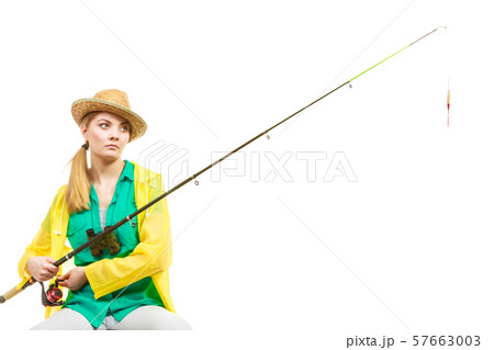 Woman with fishing rod , spinning equipment Woman with fishing rod , spinning equipment 57663003
