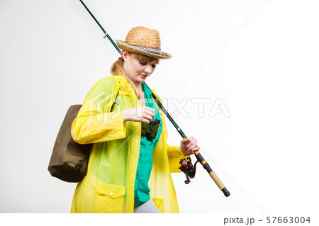 Woman with fishing rod, spinning equipment 57663004