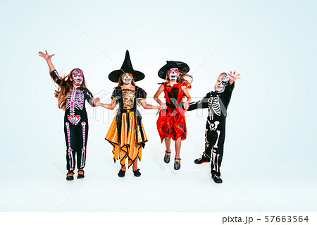 Kids or teens like witches and vampires on white background 57663564