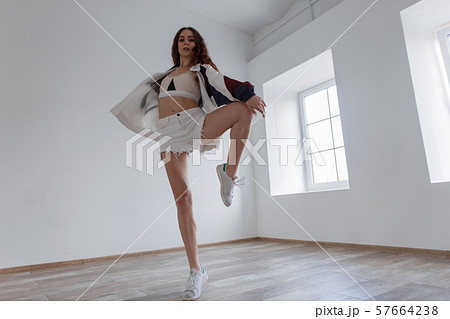 Attractive young woman dancer in sportswear 57664238