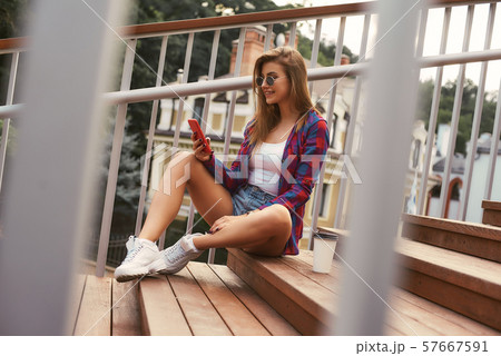 Beautiful girl relaxing in the summer city 57667591