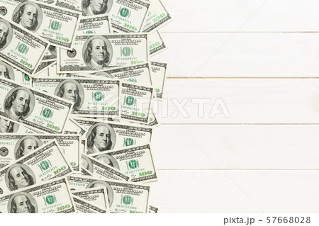 One hundred dollar banknotes on colored background 57668028