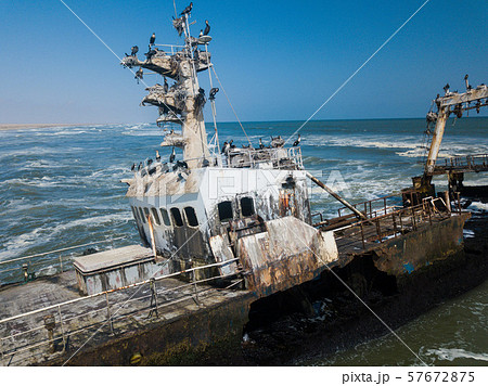 Abandoned and derelict old shipwreck Zeila at the Atlantic Coast near Swakopmund and famous Skeleton Abandoned and derelict old shipwreck Zeila at the Atlantic Coast near Swakopmund and famous Skeleton 57672875