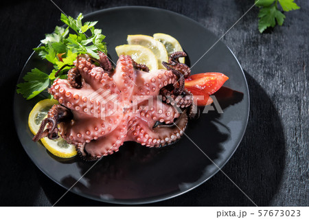 Stuffed octopus in white wine with lemon and 57673023