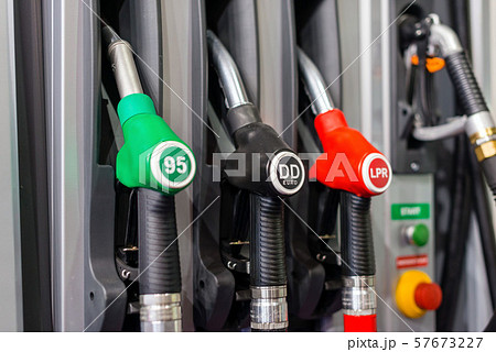 Colorful Petrol pump filling nozzles , Gas station in a service in daytime. Colorful Petrol pump filling nozzles , Gas station in a service in daytime. 57673227