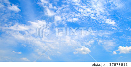 Fluffy clouds in the blue sky. Wide photo. 57673611