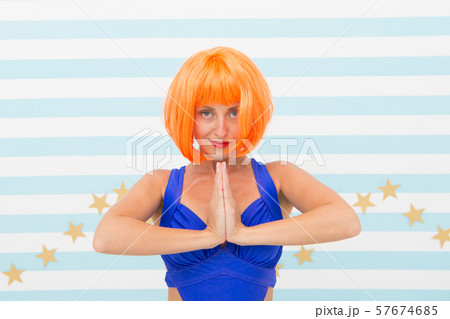 namaste. crazy girl with orange hair practicing namaste. crazy girl with orange hair practicing 57674685