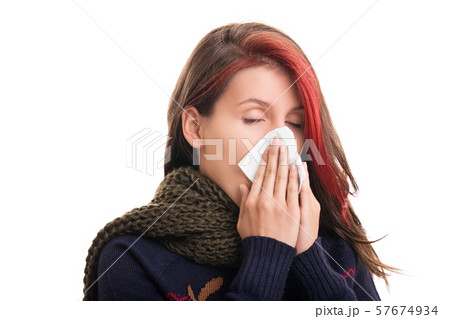 Portrait of a girl in winter clothes blowing her Portrait of a girl in winter clothes blowing her 57674934