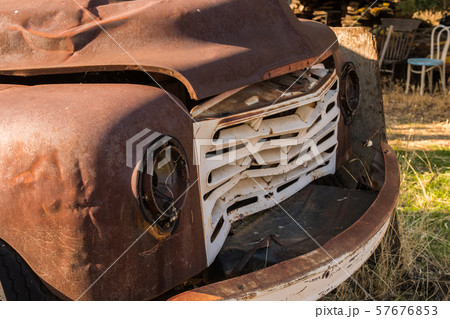 Detail of the broken front of an old rusty and abandoned pickup in Maryhill Detail of the broken front of an old rusty and abandoned pickup in Maryhill 57676853