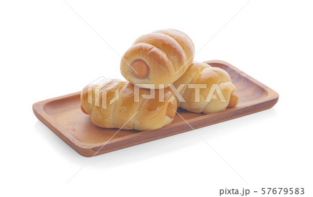 Fresh hot crusty bread rolls. Sausages in dough 57679583