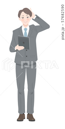 照れる　ポーズ　タブレット　ビジネス　スーツ　男性　全身 57682590