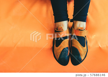 Foot in sports shoes. 57686146