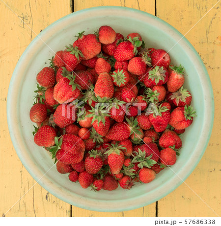 Heap of rganic Strawberry in a plastic bowl top Heap of rganic Strawberry in a plastic bowl top 57686338