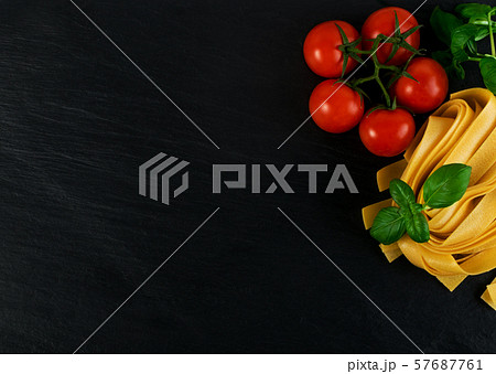Raw yellow italian pasta pappardelle, fettuccine 57687761