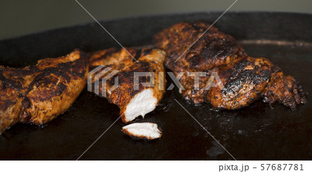 Close up of hot and tasty meat preparing on grill 57687781