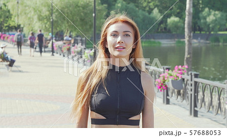 Happy healthy woman enjoying running outdoors 57688053