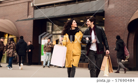 Consumerism concept. Couple shopping on weekend in mall 57690484