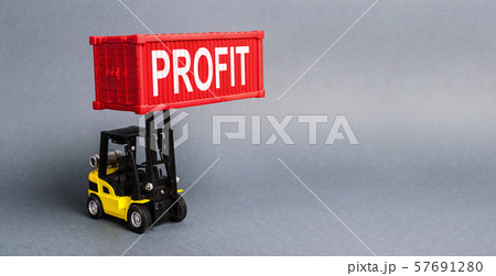 A yellow forklift lifts a red container labeled Profit. The concept of raising profits and income from successful investments and profitable business. Optimization and increase sales. Advertising A yellow forklift lifts a red container labeled Profit. The concept of raising profits and income from successful investments and profitable business. Optimization and increase sales. Advertising 57691280