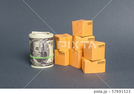 Roll of dollars and cardboard boxes. Business and industry. The concept of commerce and trade. retail and distribution. Performance efficient production. Production and export of products and goods. Roll of dollars and cardboard boxes. Business and industry. The concept of commerce and trade. retail and distribution. Performance efficient production. Production and export of products and goods. 57691523