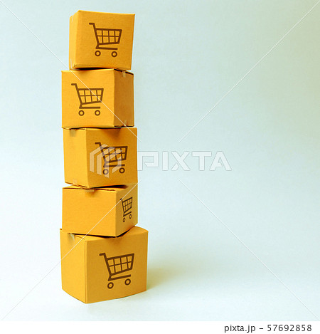 Tower of cardboard boxes with pattern of shopping carts on a blue background. commerce, online shopping. E-commerce, logistics, distribution and sales. Purchasing power, delivery order. 57692858