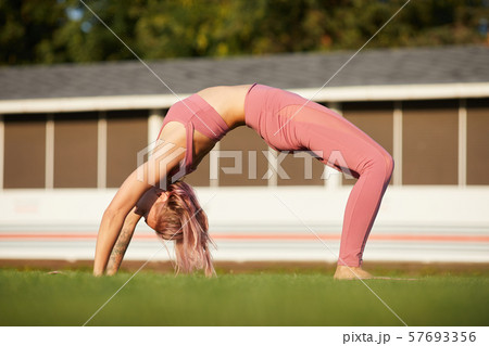 Stretching exercise outdoors Stretching exercise outdoors 57693356