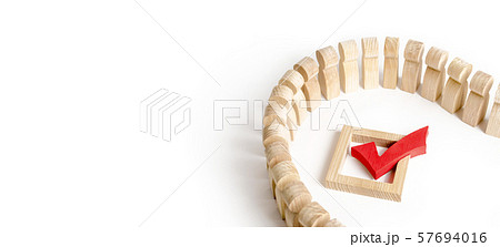 A queue of people and a red check mark on a white background. Democracy and legitimacy. The concept of elections and important decisions, a referendum, a poll. presidency or parliamentary election 57694016