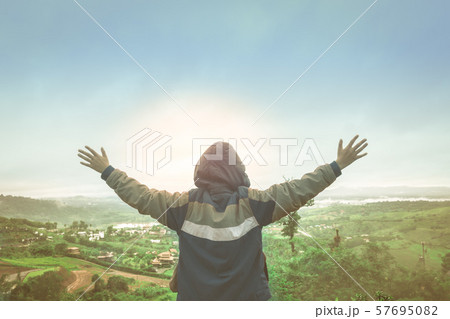 Happy Asian boy wearing a hood are raising her Happy Asian boy wearing a hood are raising her 57695082