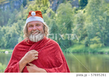 Laughing Santa Claus fell in the summer. Against 57695261