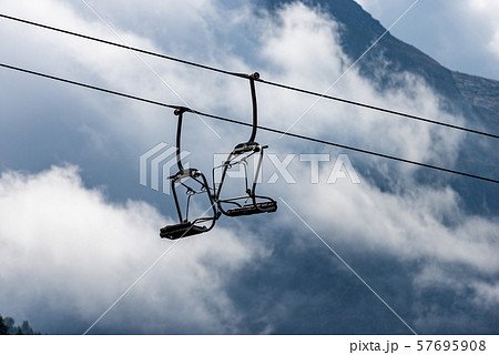 Chairlift - Elevated passenger ropeway in Italian Alps 57695908
