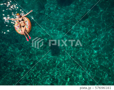 Top down view of a beautiful woman in a white Top down view of a beautiful woman in a white 57696181