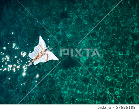 Top down view of a beautiful woman in a white 57696188