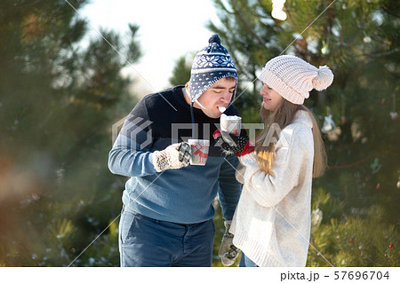 The guy with the girl walk and kiss in the winter The guy with the girl walk and kiss in the winter 57696704