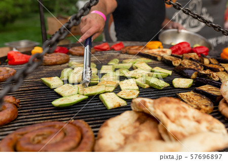 A large round grill on the coals in which grilled 57696897