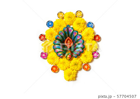 Happy Diwali - Clay Diya lamps lit during Dipavali, Hindu festival of lights celebration. Colorful traditional oil lamp diya on white background. Happy Diwali - Clay Diya lamps lit during Dipavali, Hindu festival of lights celebration. Colorful traditional oil lamp diya on white background. 57704507