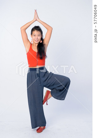 Full body shot of happy beautiful Asian woman posing ready for yoga sessions 57706049