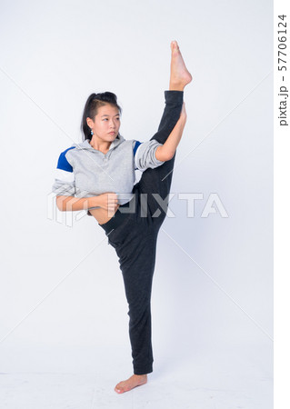 Full body shot of beautiful Asian woman stretching and ready for gym Full body shot of beautiful Asian woman stretching and ready for gym 57706124