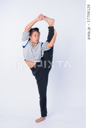 Full body shot of beautiful Asian woman stretching and ready for gym Full body shot of beautiful Asian woman stretching and ready for gym 57706126