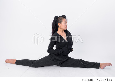 Full body shot of beautiful Asian woman stretching 57706143