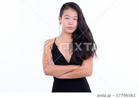 Portrait of beautiful Asian woman with arms crossed ready to party Portrait of beautiful Asian woman with arms crossed ready to party 57706562