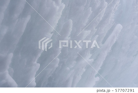 Snow wall close-up. White clean snow surface. Snow wall close-up. White clean snow surface. 57707291