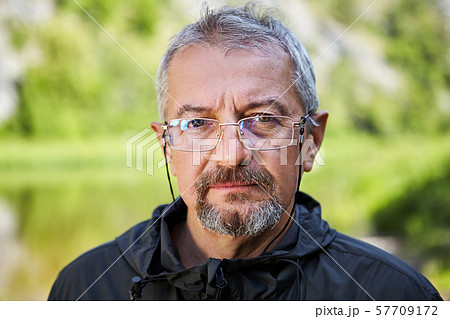 Serious mature man with glasses. Serious mature man with glasses. 57709172