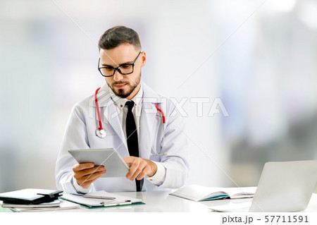 Doctor using tablet computer at the hospital. 57711591