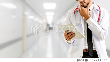 Doctor using tablet computer at the hospital. 57711637