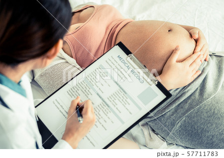 Pregnant Woman and Gynecologist Doctor at Hospital 57711783