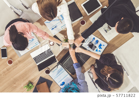 Teamwork business people join hands in meeting. 57711822