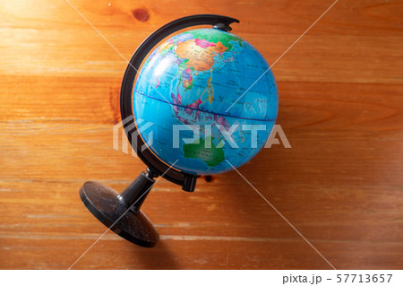 Plastic globes on wooden floors. 57713657