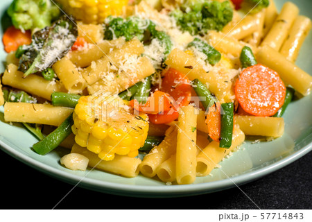Delicious fresh warm paste sprinkled with cheese parmesan  57714843