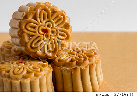 Moon cake on white and brown background Moon cake on white and brown background 57716344