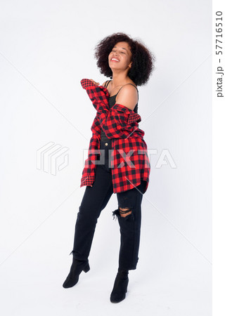 Full body shot of happy young beautiful African hipster woman smiling 57716510
