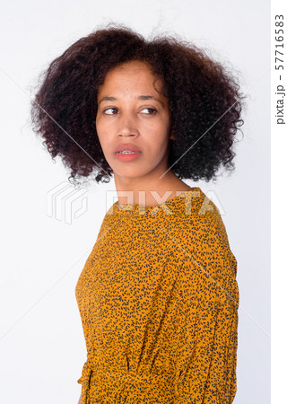 Portrait of young beautiful African woman thinking and looking back 57716583